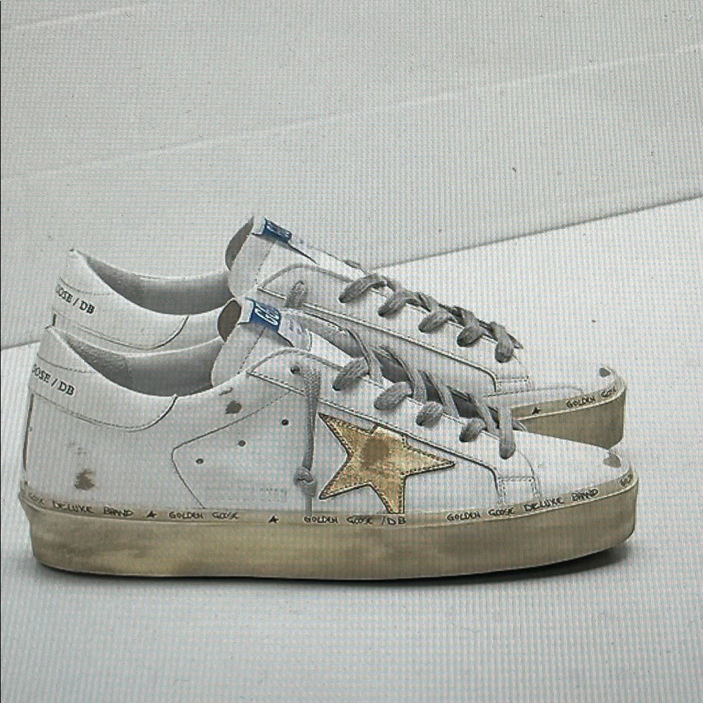 Golden goose high star sneakers with gold star